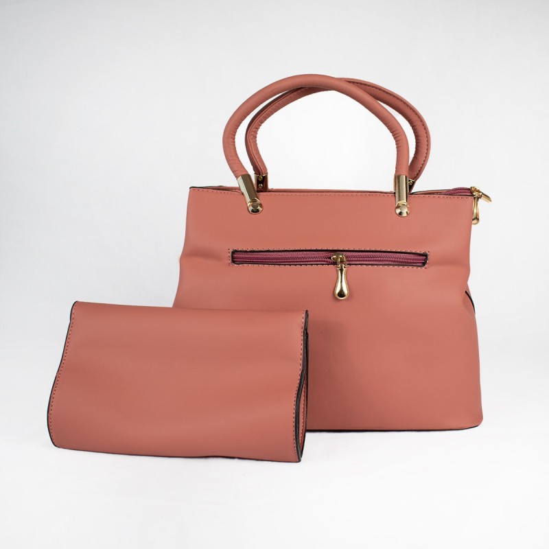 Cartera con bolso de mano color palo rosa elegante y moderna accesorio femenino moda chilena